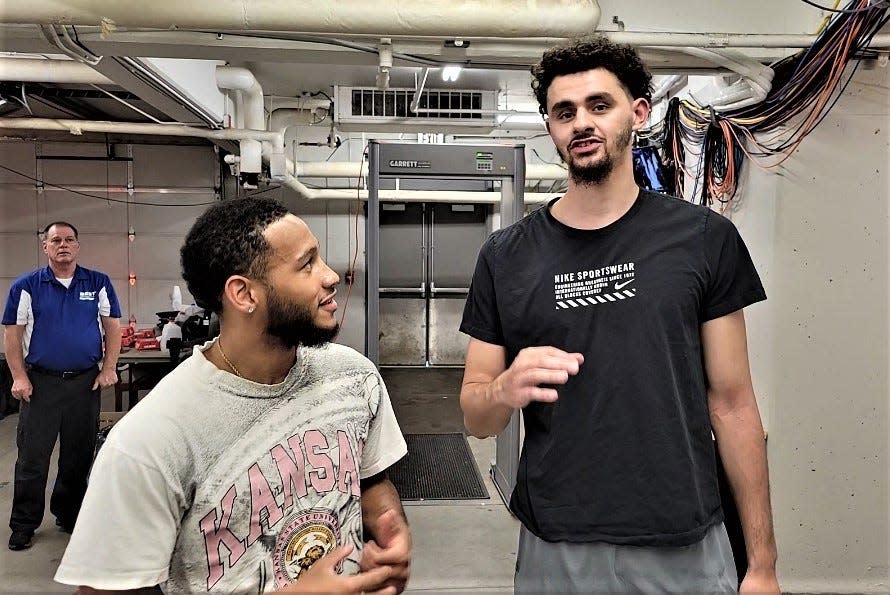 Kansas State's Markquis Nowell, left, and Ismael Massoud were in Wichita last month supporting the Purple & Black alumni team during The Basketball Tournament at Koch Arena.