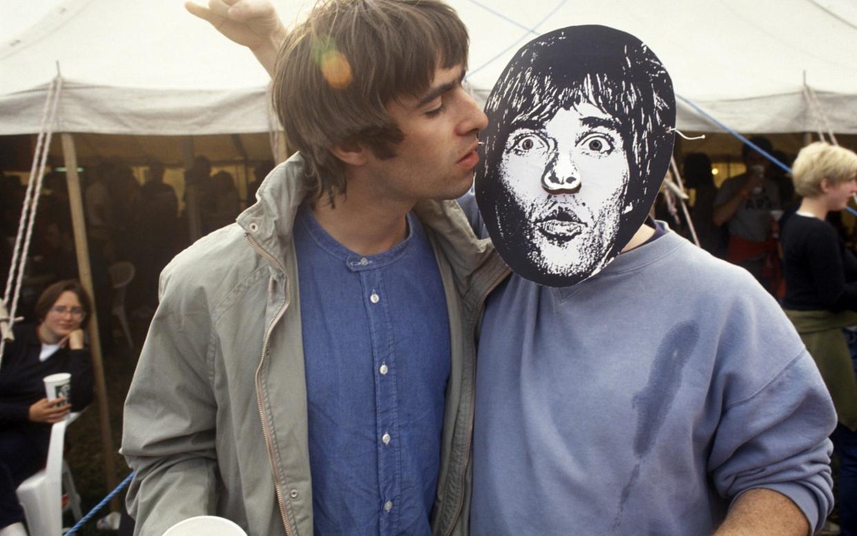 Liam Gallagher at Glastonbury 1995 with an Ian Brown stand-in  - Getty