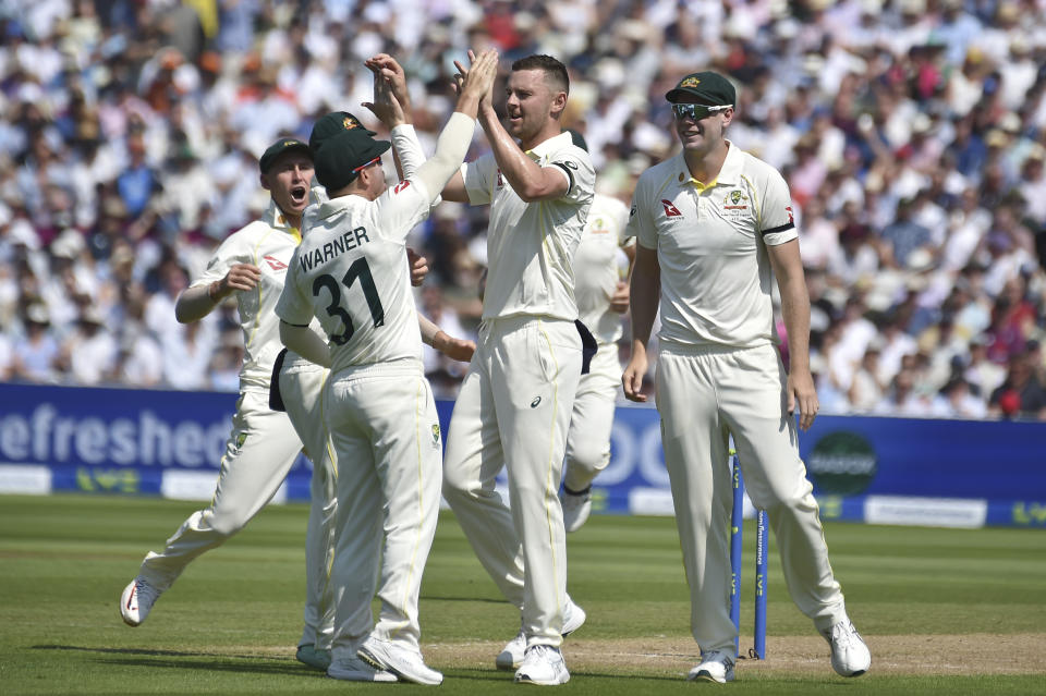 Australia's Josh Hazlewood, centre, celebrates with team mates after taking the wicket of England's Ben Duckett on day one of the first Ashes Test cricket match between England and Australia at Edgbaston, Birmingham, England, Friday, June 16, 2023. (AP Photo/Rui Vieira)