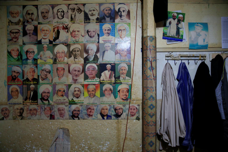 <p>Pictures of Indonesian clerics are displayed on the wall of a dormitory at Lirboyo Islamic boarding school in Kediri, Indonesia, May 20, 2018. (Photo: Beawiharta/Reuters) </p>