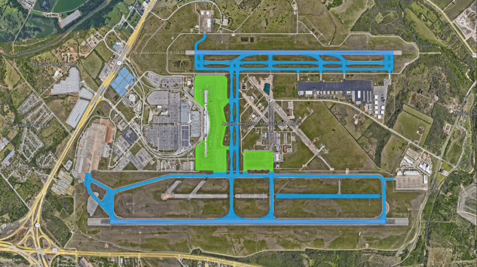 An aerial view of the airport shows the ramp (green) and the taxiways and runways (blue) (Photo Courtesy City of Austin).