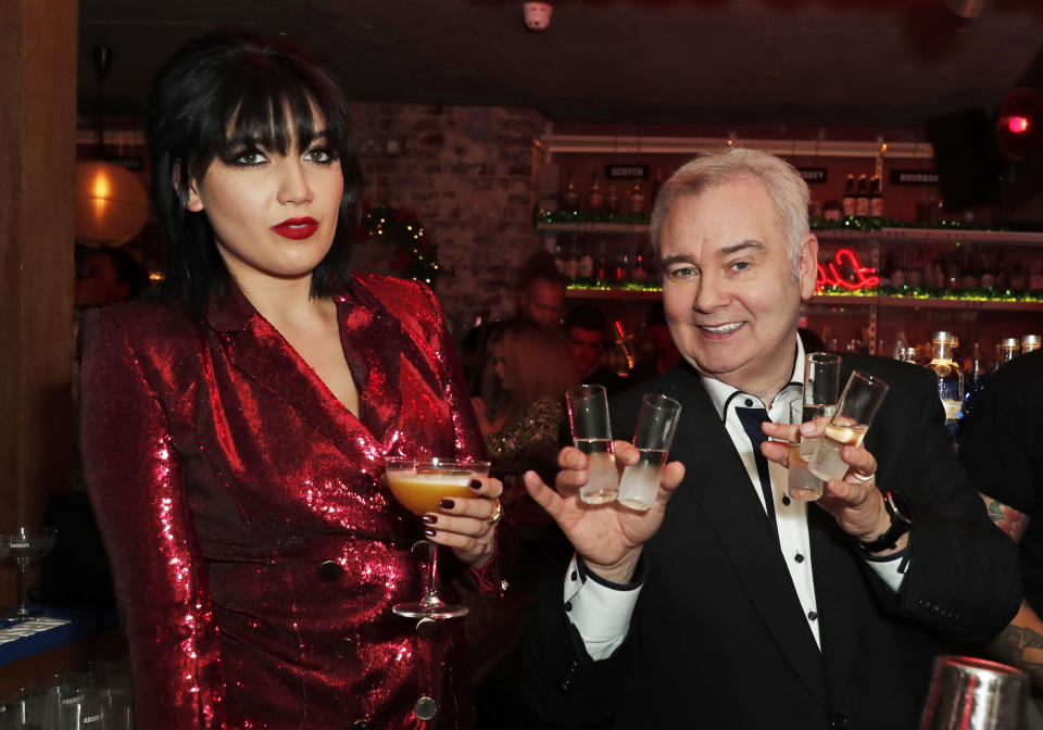 LONDON, ENGLAND - DECEMBER 16: Daisy Lowe (L) and Eamonn Holmes at the celebration of Absolut Crackers on December 16, 2019 in London, England. (Photo by David M. Benett/Dave Benett/Getty Images for Absolut Vodka UK)