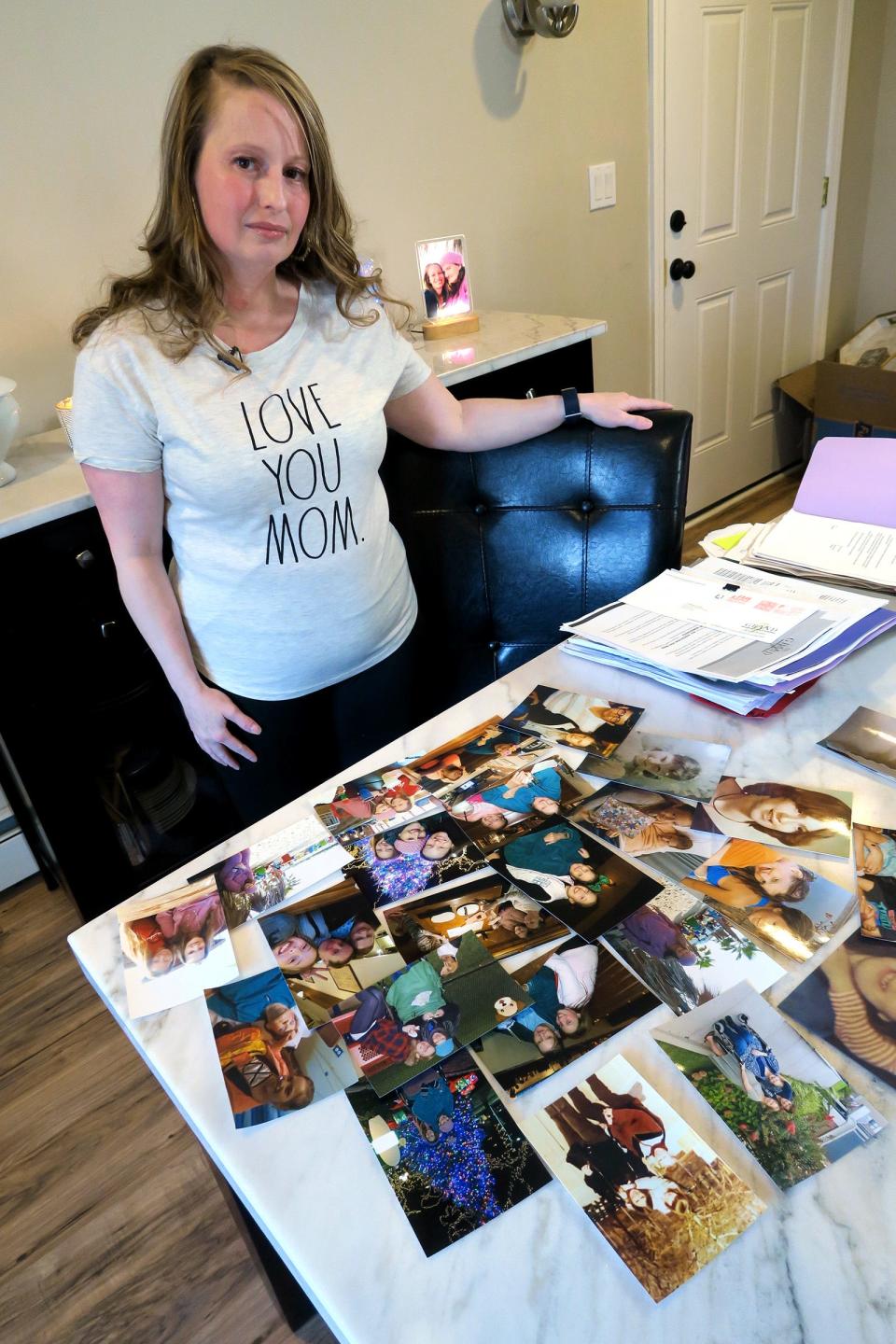 Theresa Sari is shown with photos of her mother Maria Sachse in her Carteret, NJ, home Wednesday, April 20, 2022.  Theresa filed numerous complaints over the care her mother received at The Grand Rehabilitation and Nursing at South Point in Island Park, New York.