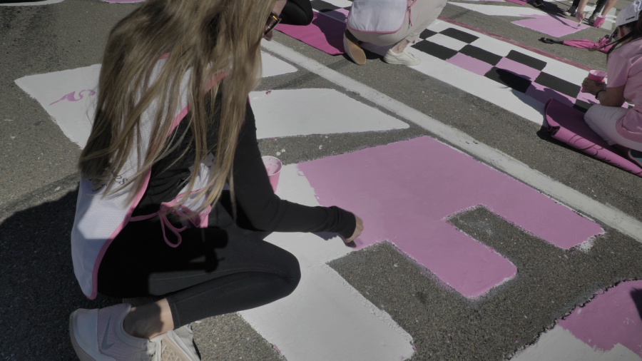 Survivors painted the start/finish line pink in honor of National Breast Cancer Awareness month for the Oct. 14-15 NASCAR Weekend. (