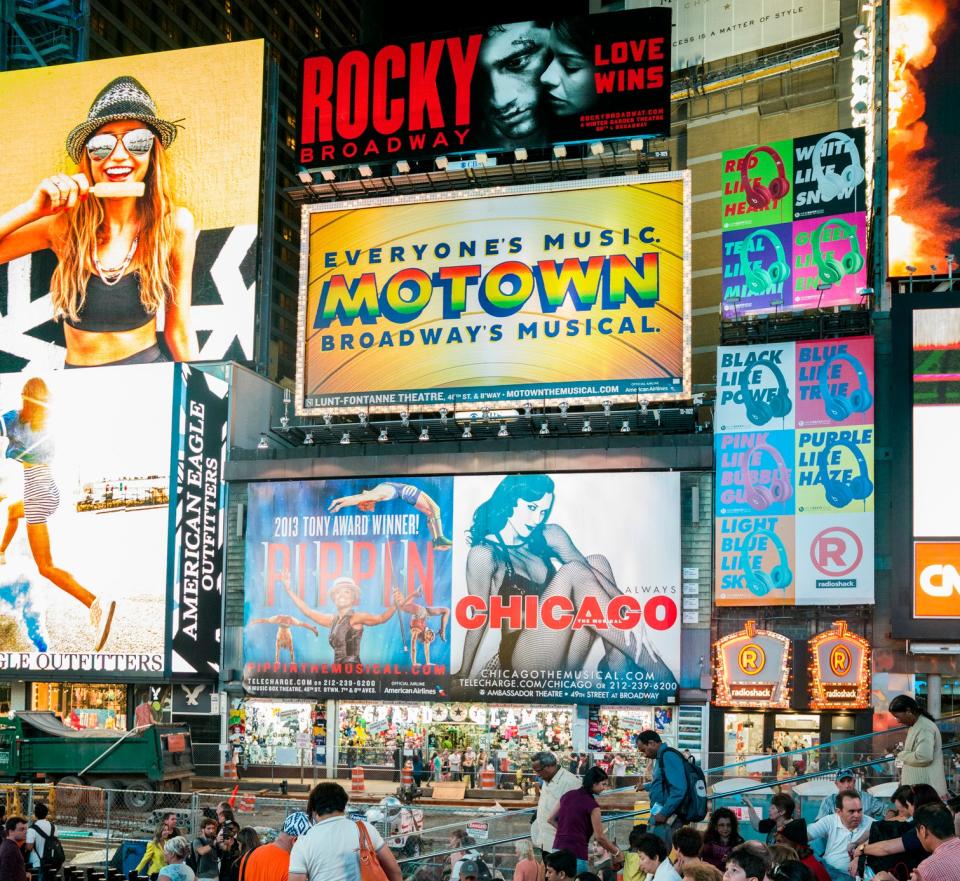 Billboards for Broadway shows are displayed in Times Square