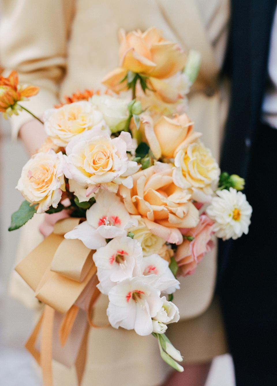 As a florist, I’ve made countless wedding bouquets, but never for myself! Soft, glorious garden roses, gladiolus with ruby throats (my grandmother’s favorite), ruffly nude carnations, and dahlias because it was September after all. I put it together without overthinking it too much, and the shape was bit of a Constance Spry inspired crescent. I lavished myself with yards of creamy vintage silk grosgrain ribbons, wrapping it up like a blousy wedding present.