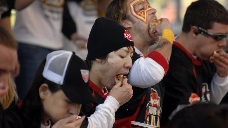 Contestants at burger eating competition