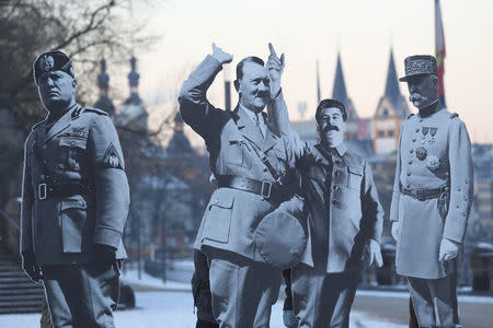 FILE PHOTO:Activists placed life-size cardboards, depicting Benito Mussolini, Adolf Hitler, Josef Stalin and Philippe Petain in front of the Kaiser Wilhelm monument at the Deutsches Eck ("German Corner") to protest against a European far-right leaders meeting, in Koblenz, Germany, January 21, 2017. REUTERS/Kai Pfaffenbach/File Photo