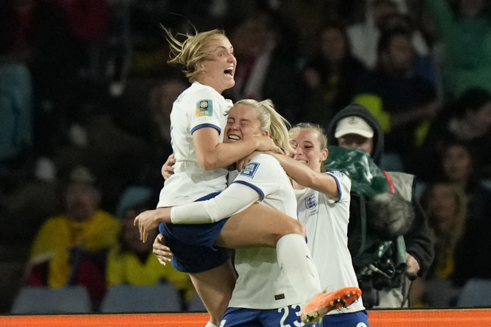 England's Alessia Russo, center, celebrates after scoring her side's 2nd goal during the Women's World Cup quarterfinal soccer match between England and Colombia at Stadium Australia in Sydney, Australia, Saturday, Aug. 12, 2023. (AP Photo/Rick Rycroft)
