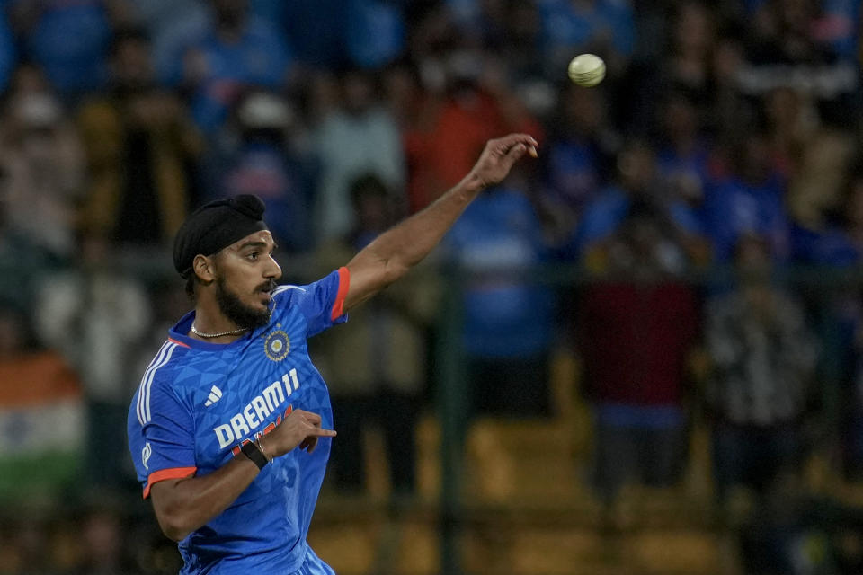 India's Arshdeep Singh throws the ball toward the stumps during the fifth T20 cricket match between India and Australia in Bengaluru, India, Sunday, Dec. 3, 2023. (AP Photo/Aijaz Rahi)