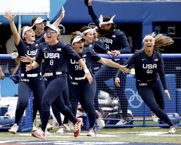 TOKYO, - JULY 26: U.S. softball players go crazy after Kelsey Stewart hit a walk-off.