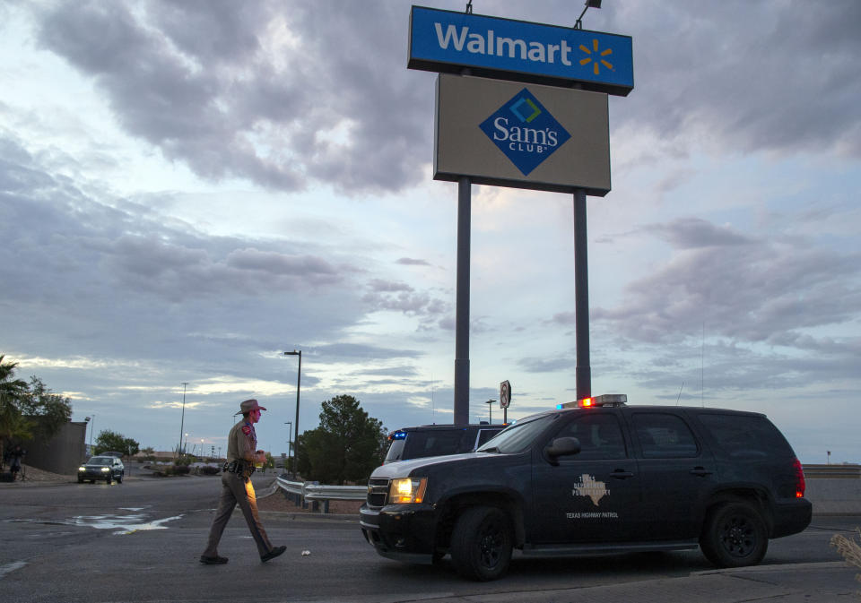 FILE - In this Aug. 4, 2019, file photo a Texas State Trooper walks back to his car while providing security outside the Walmart store in the aftermath of a mass shooting in El Paso, Texas. Like most retailers, Walmart is accustomed to the everyday dealings of shoplifters. Now, it’s confronting a bigger threat: active shooters. Days after a man opened fire at one of its stores in El Paso and left several dead, the nation’s largest retailer is faced with how to make its workers and customers feel safe. (AP Photo/Andres Leighton, File)