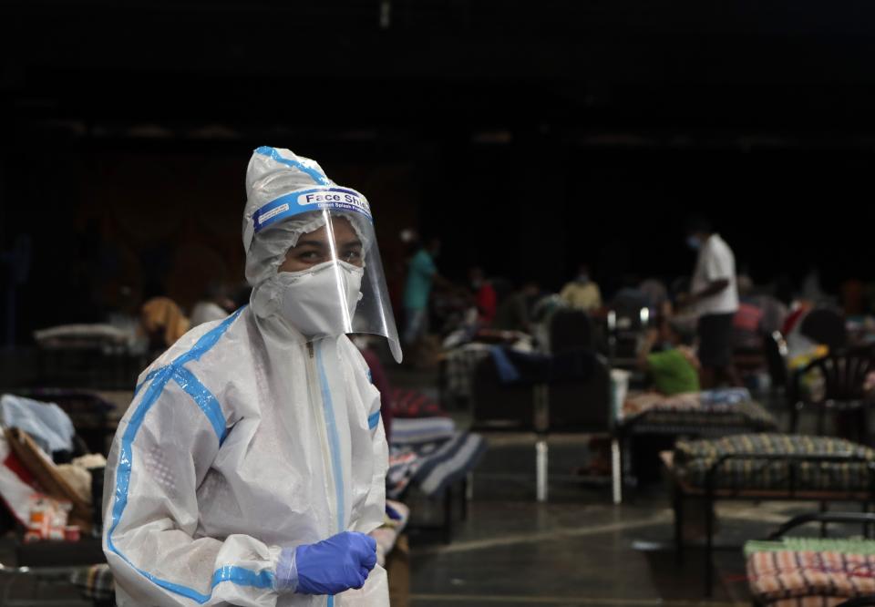 A doctor works at an COVID-19 isolation center in Mumbai, India, Wednesday, July 8, 2020. India has overtaken Russia to become the third worst-affected nation by the coronavirus pandemic. (AP Photo/Rajanish Kakade)