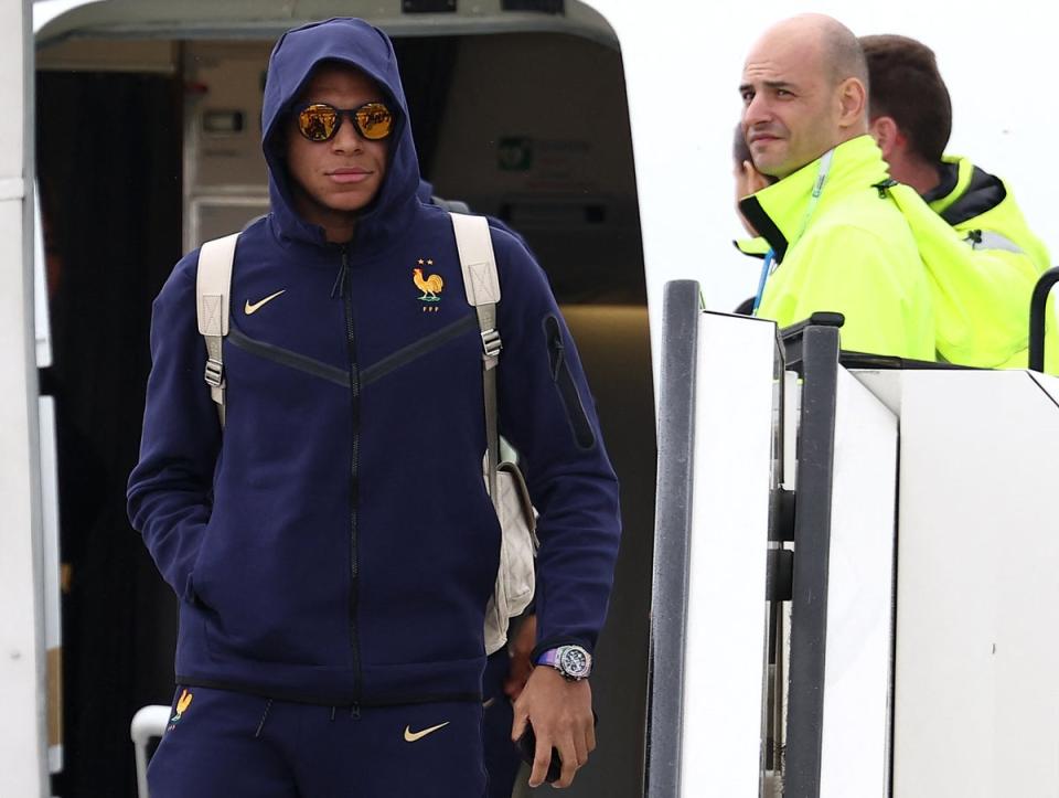 Kylian Mbappe disembarks as he arrives at the airport in Paderborn Lippstadt (AFP via Getty Images)