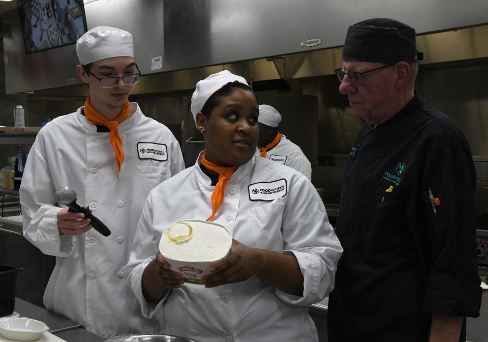 Matthew Lewis, left, Ayrias Siggers and David McKenty, chef trainer, discuss ice cream Wednesday, Nov. 30, 2022, at the Wor-Wic Community College in Salisbury, Maryland. 