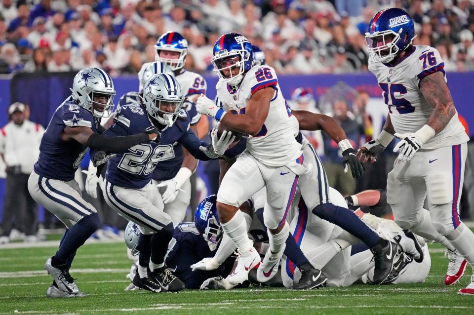 New York Giants running back Saquon Barkley (26) ran for a touchdown during the second half against the Dallas Cowboys at MetLife Stadium in Week 3. Dallas won 23-16.