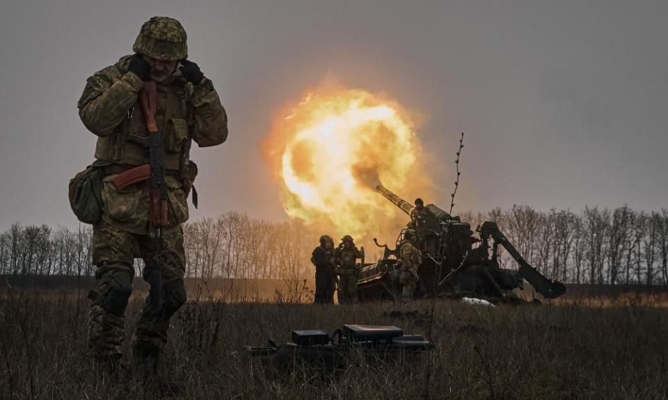 Ukrainian soldiers fire artillery at Russian positions near Bakhmut, in the Donetsk region.