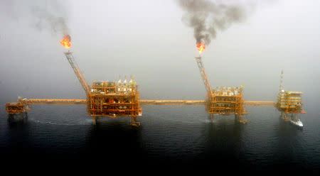 FILE PHOTO: Gas flares from an oil production platform at the Soroush oil fields in the Persian Gulf, south of the capital Tehran, July 25, 2005. REUTERS/Raheb Homavandi/File Photo