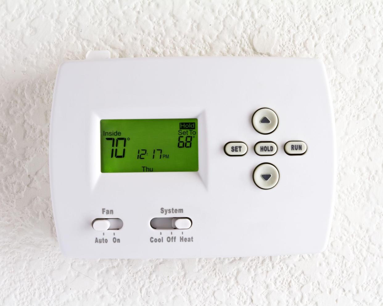 digital thermostat on white wall