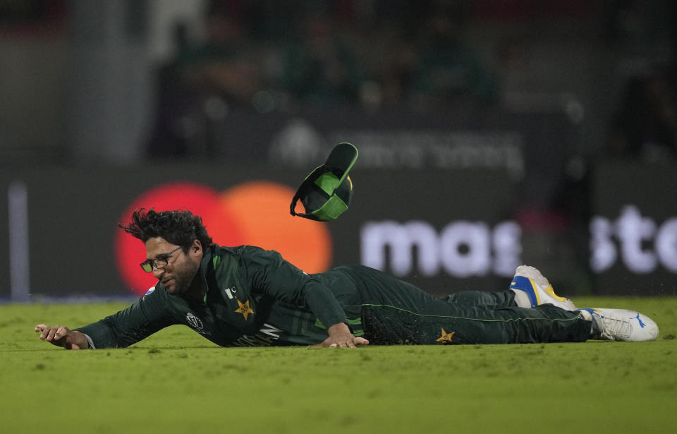 Pakistan's Imam-ul-Haq dives to field the ball during the ICC Men's Cricket World Cup match between Pakistan and Afghanistan in Chennai , India, Monday, Oct. 23, 2023. (AP Photo/Anupam Nath)