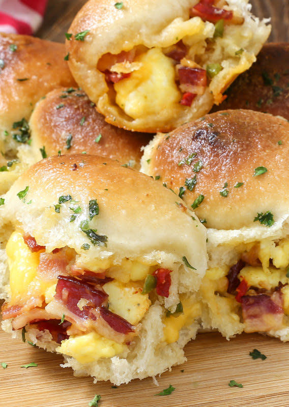 <p>The Slow Roasted Italian</p><p>Cheesy Bacon and Egg Breakfast Bombs are soft and tender portable poppers, stuffed with smoky bacon, scrambled eggs and ooey gooey cheese, topped with garlic herb butter! This scrumptious recipe is the pull apart egg breakfast of your dreams!</p><p><strong>Get the recipe: <a href="https://www.theslowroasteditalian.com/2016/11/cheesy-bacon-and-egg-breakfast-bombs.html" rel="nofollow noopener" target="_blank" data-ylk="slk:Cheesy Bacon and Egg Breakfast Bombs;elm:context_link;itc:0;sec:content-canvas" class="link rapid-noclick-resp">Cheesy Bacon and Egg Breakfast Bombs</a></strong></p>