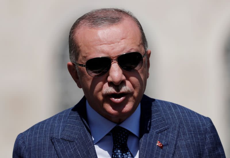 FILE PHOTO: Turkish President Tayyip Erdogan talks to media after attending Friday prayers at Hagia Sophia Grand Mosque in Istanbul