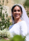 <p>She may have married into the royal family on May 19, but the former actress still showed off her own personal style on the big day. Accessorized with Queen Mary’s filigree tiara and a Givenchy veil, Meghan wore a wispy low bun to wed Prince Harry. (Photo: Getty Images) </p>