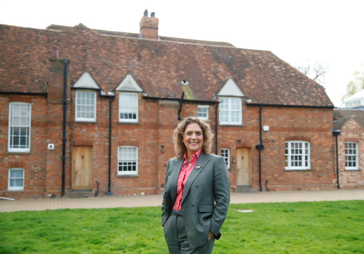 Hannah Ingram-Moore, Captain Tom's daughter, poses for a portrait outside the family home as she launches 'Captain Tom 100'  - a new fundraising initiative to celebrate the joy and hope her father brought to millions, in Marston Moretaine, near Milton Keynes, Britain March 31, 2021. Picture taken March 31 2021. REUTERS/Andrew Boyers