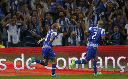 Porto's Andre Andre (L) celebrates his goal next to his teammate Maxi Pereira during their Portuguese premier league soccer match against Benfica at Dragao stadium in Porto, Portugal September 20, 2015. REUTERS/Rafael Marchante