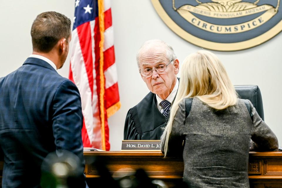 Defense attorney Patrick O'Keefe, left, and Ingham County Assistant Prosecutor Kristen Rolph, right, approach the bench of Ingham County Circuit Judge David L. Jordon during the trial for Parker Surbrook on Friday, Aug. 4, 2023, at the 30th Circuit Court Annex in Lansing.