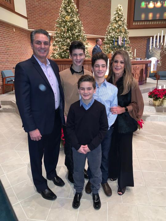 The Carroll family – Brian and his wife, Angie, and their sons, back to front, Benny, Dominic and Sammy – was reeling when Brian was fired in January 2019.