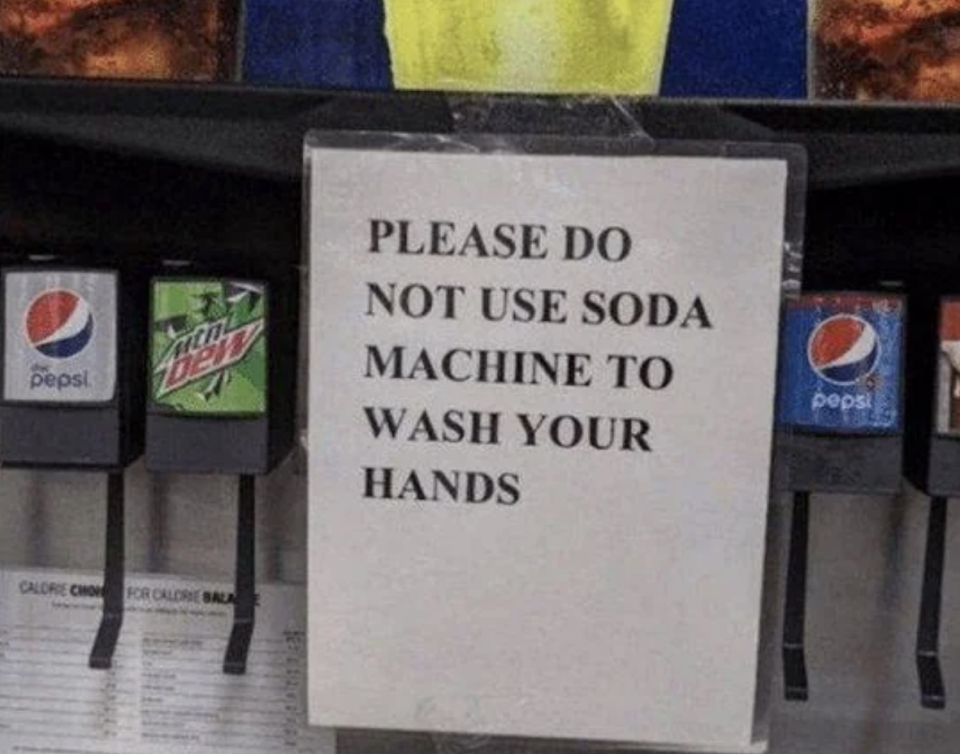 Sign reads "PLEASE DO NOT USE SODA MACHINE TO WASH YOUR HANDS" on a soda fountain machine