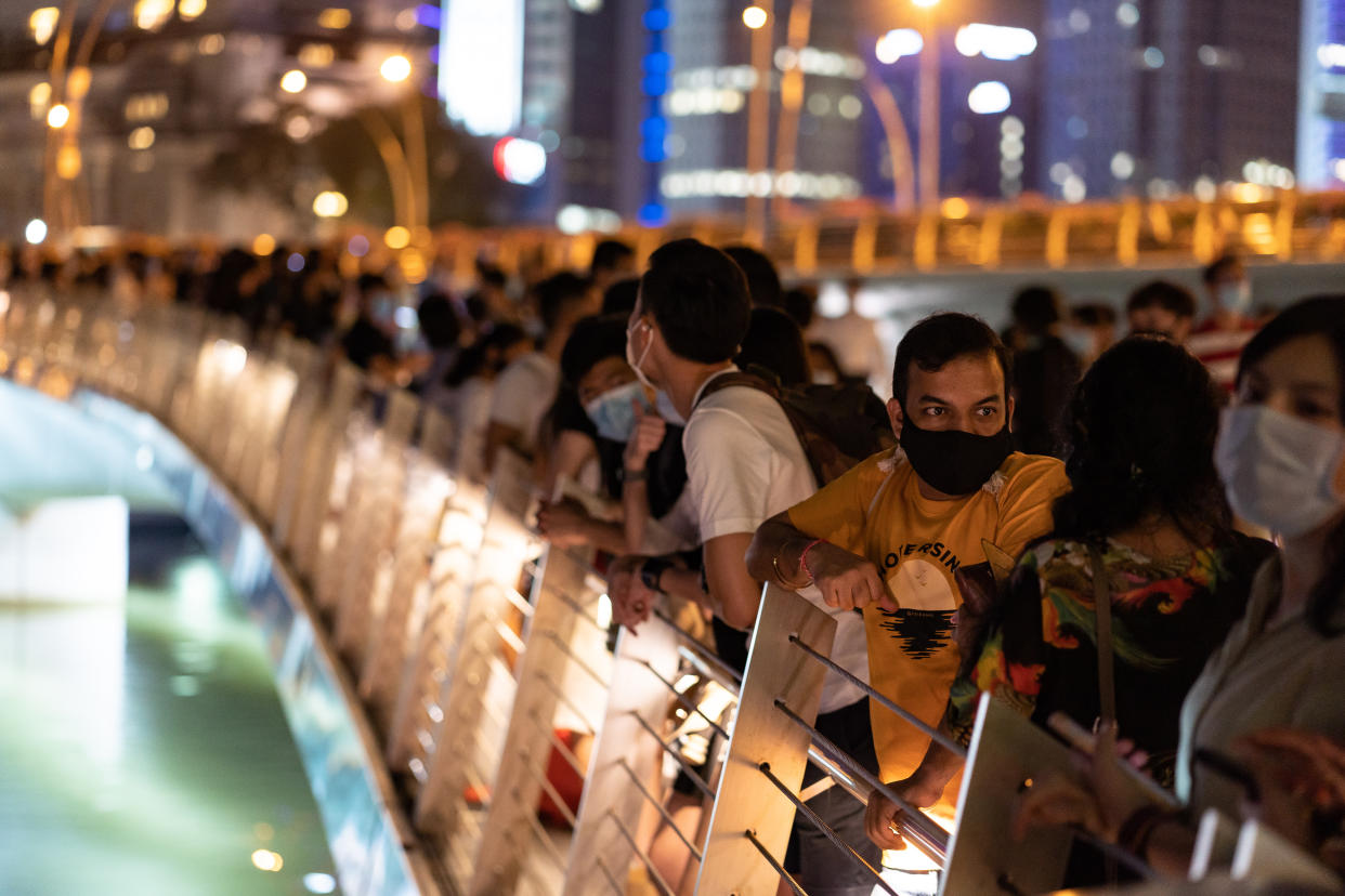 People gathered at the Marina Bay area to watch the light show and usher in 2021. (PHOTO: Getty Images)