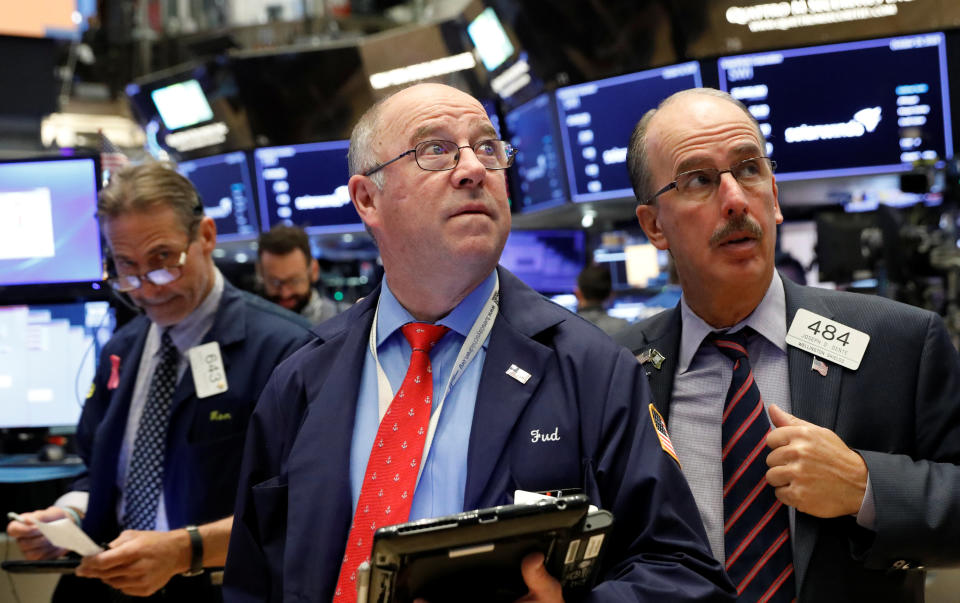 Traders work on the floor of the New York Stock Exchange (NYSE) in New York, U.S., October 19, 2018. REUTERS/Brendan McDermid