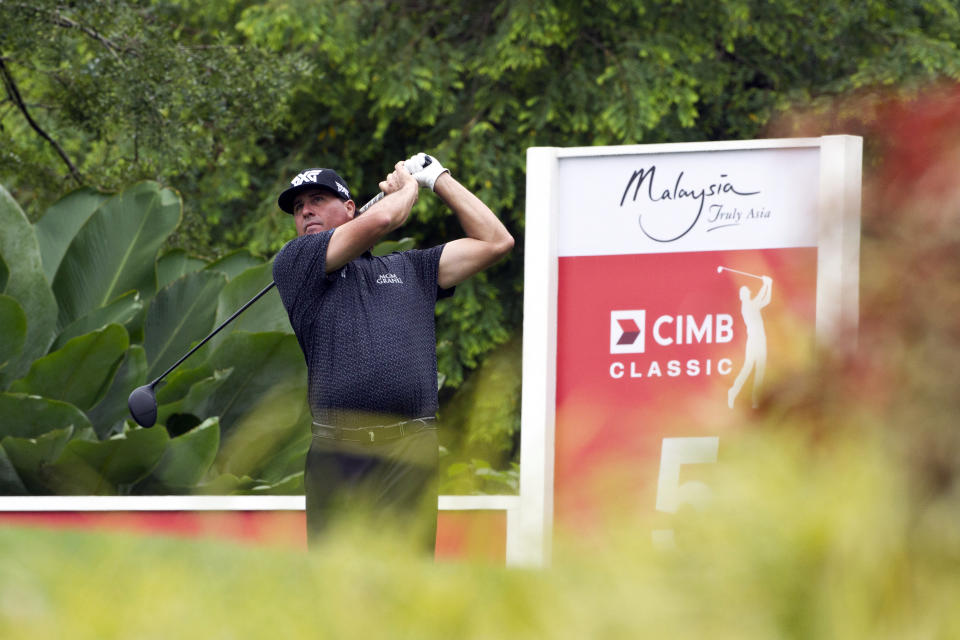 Pat Perez of the United States follows his shot on the fifth hole during round two of the CIMB Classic golf tournament at Tournament Players Club (TPC) in Kuala Lumpur, Malaysia, Friday, Oct. 12, 2018. (AP Photo/Yam G-Jun)