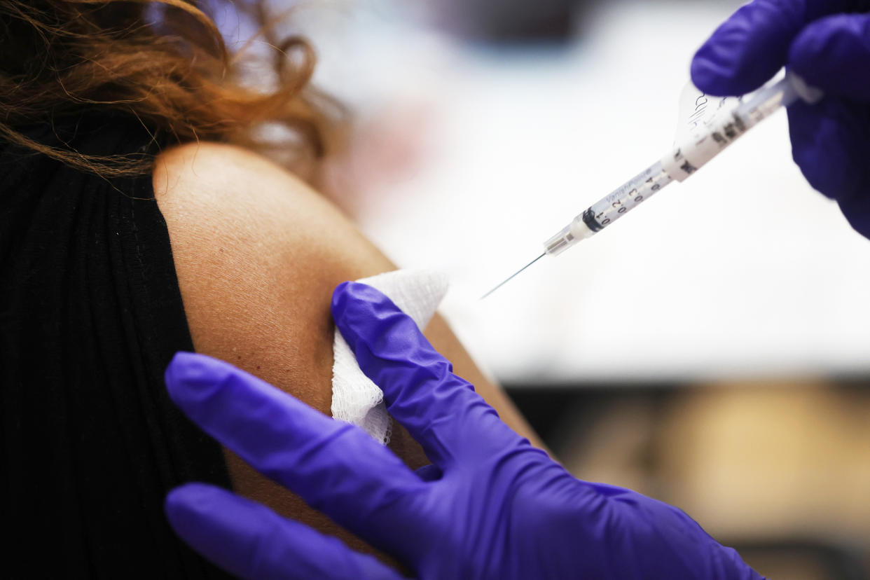 A nurse administers a COVID-19 booster shot (Scott Olson / Getty Images file)