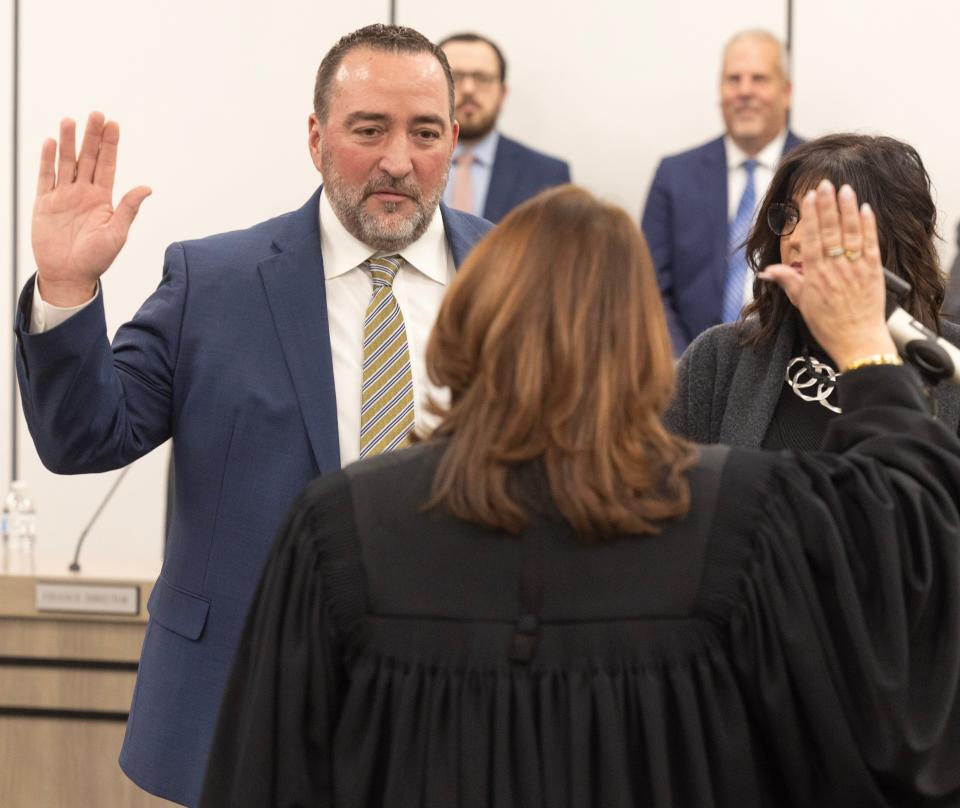 Judge Taryn Heath swears-in William Sherer II as the new Mayor of Canton. Next to Sherer is his wife Carrie Sherer.