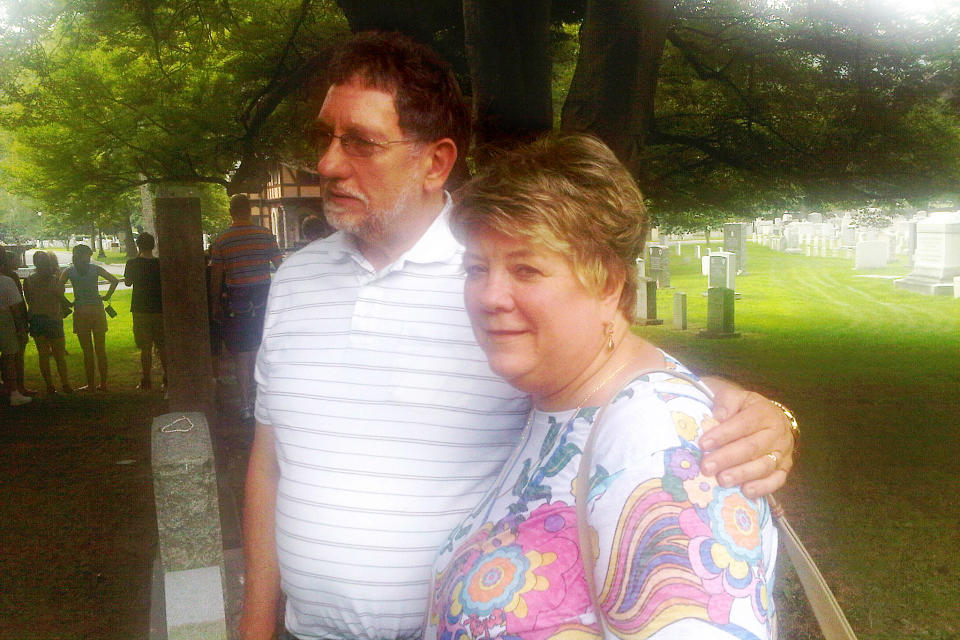 In this photo of Aug. 3, 2012, Dave and Deb Maciewicz of Barneveld, N.Y., pause in West Point Cemetery during a tour of the U.S. Military Academy in West Point, N.Y. Suburbs in the New York metropolitan area are stepping up their efforts to attract tourist dollars, not by competing with New York City, but by marketing themselves as complementary destinations. (AP Photo/Jim Fitzgerald)