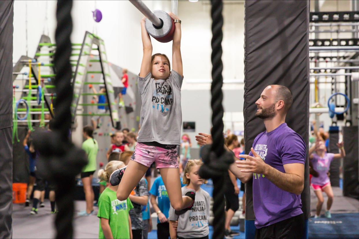 A girl tries one of many obstacles at an Ultimate Ninja facility under the supervision of Mike "The Stallion" Silenzi, a multi-season competitor on NBC's American Ninja Warrior. Wisconsin might get its first Ultimate Ninja location in Oak Creek.