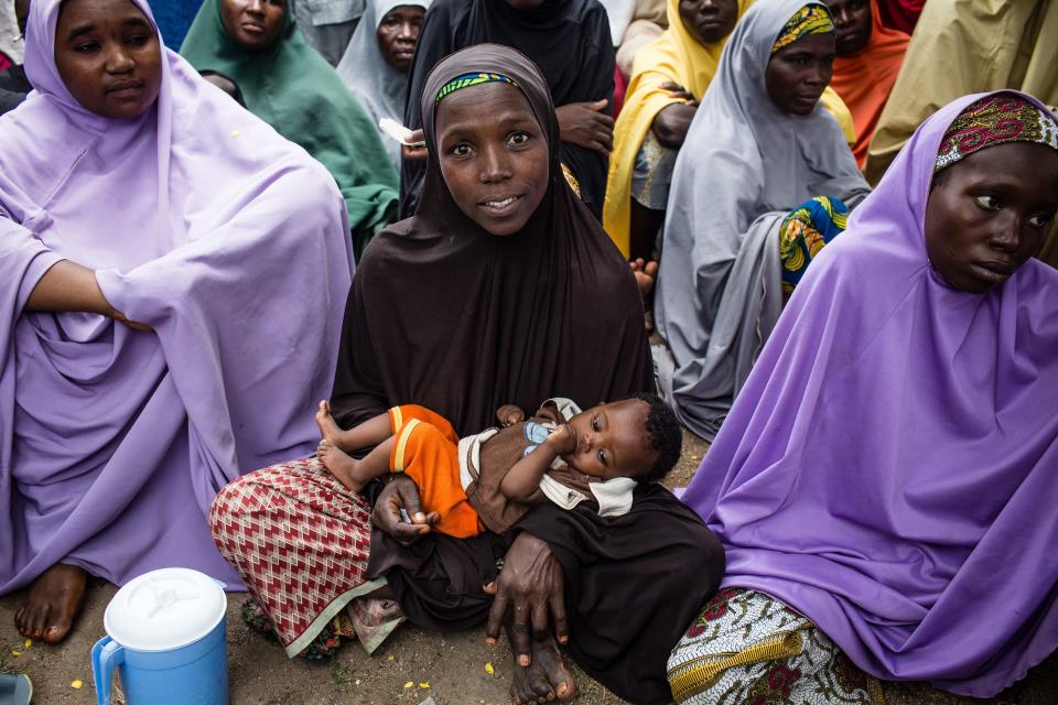 &nbsp;A crowd gathers for Mercy Corps' e-voucher distribution, in a neighborhood in Biu, Nigeria. Mercy Corps has gained access to cities and villages in south Borno state with one of the largest number of displaced people.