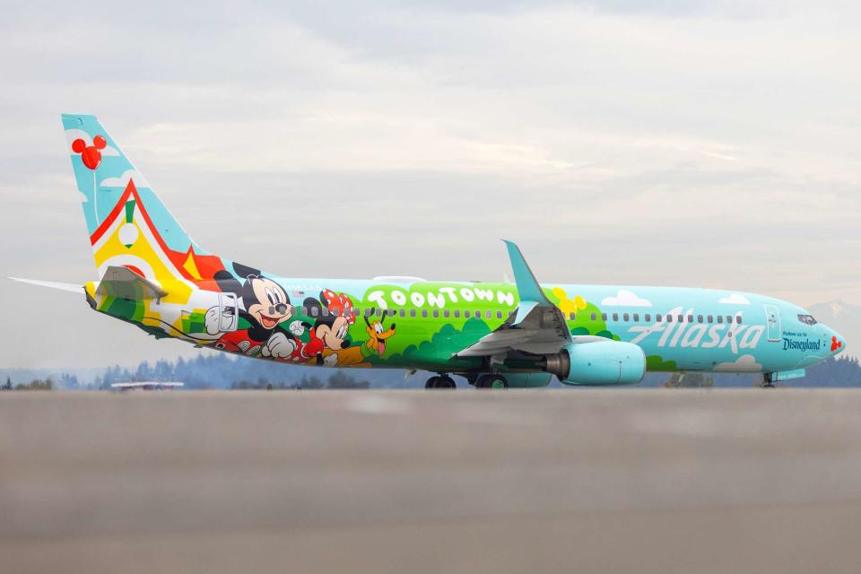 <p>Ingrid Barrentine/Alaska Airlines</p> “Mickey’s Toontown Express" plane