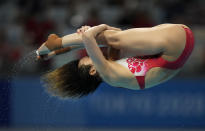 Shi Tingmao of China competes in women's diving 3m springboard final at the Tokyo Aquatics Centre at the 2020 Summer Olympics, Sunday, Aug. 1, 2021, in Tokyo, Japan. (AP Photo/Dmitri Lovetsky)