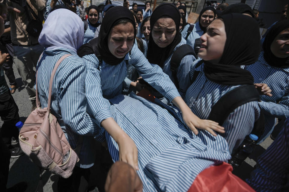 The classmates of 15-year-old Sadeel Naghniyeh carry her body during her funeral in the West Bank Jenin refugee camp Wednesday, June 21, 2023. Naghniyeh died from wounds sustained in an Israeli military raid on Monday that triggered some of the fiercest fighting with Palestinian militants in years. (AP Photo/Majdi Mohammed)