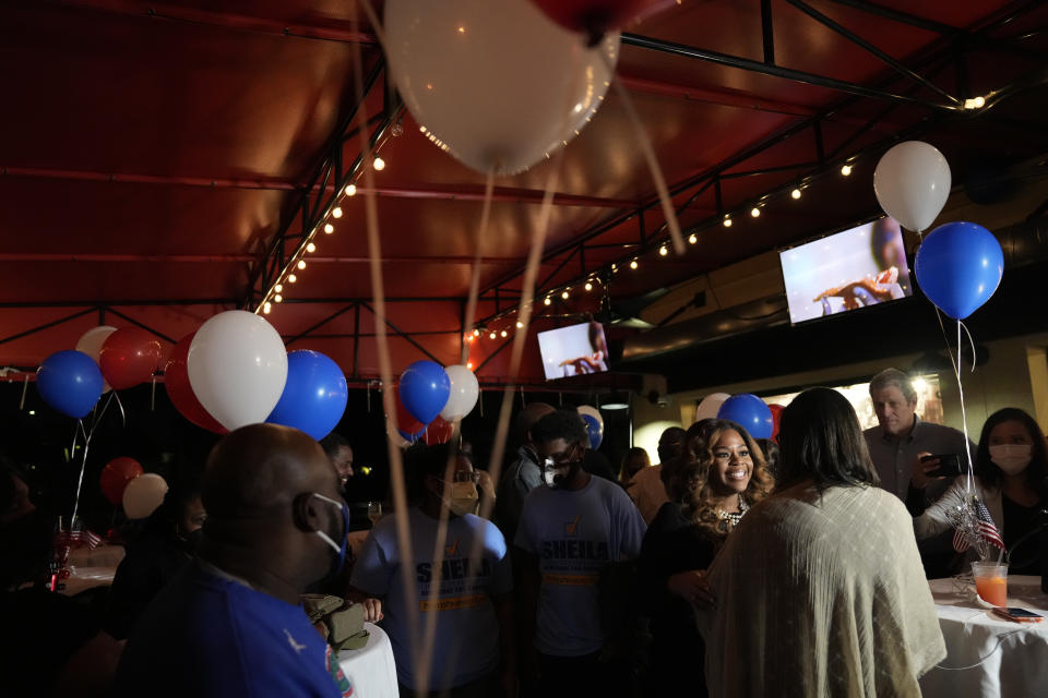 Democrat Sheila Cherfilus-McCormick, center right, greets supporters at an election night party, Tuesday, Jan. 11, 2022, in Fort Lauderdale, Fla. Cherfilus-McCormick, a health care company CEO, defeated Republican Jason Mariner in a special election to fill Florida's 20th Congressional District seat, left vacant after Democratic U.S. Rep. Alcee Hastings died last April of pancreatic cancer. (AP Photo/Rebecca Blackwell)