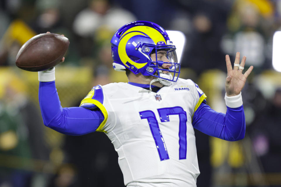 Los angles Rams quarterback Baker Mayfield (17) throws before an NFL football game against the Green Bay Packers in Green Bay, Wis. Monday, Dec. 19, 2022. (AP Photo/Matt Ludtke)