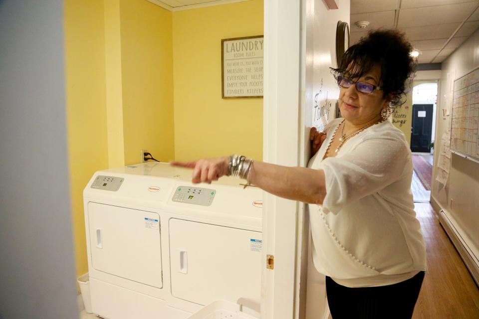 Theresa Tozier, founder and executive director of Lydia's House of Hope, explains women in the home are responsible for doing their own laundry, as seen Friday, May 13, 2022 in Somersworth.