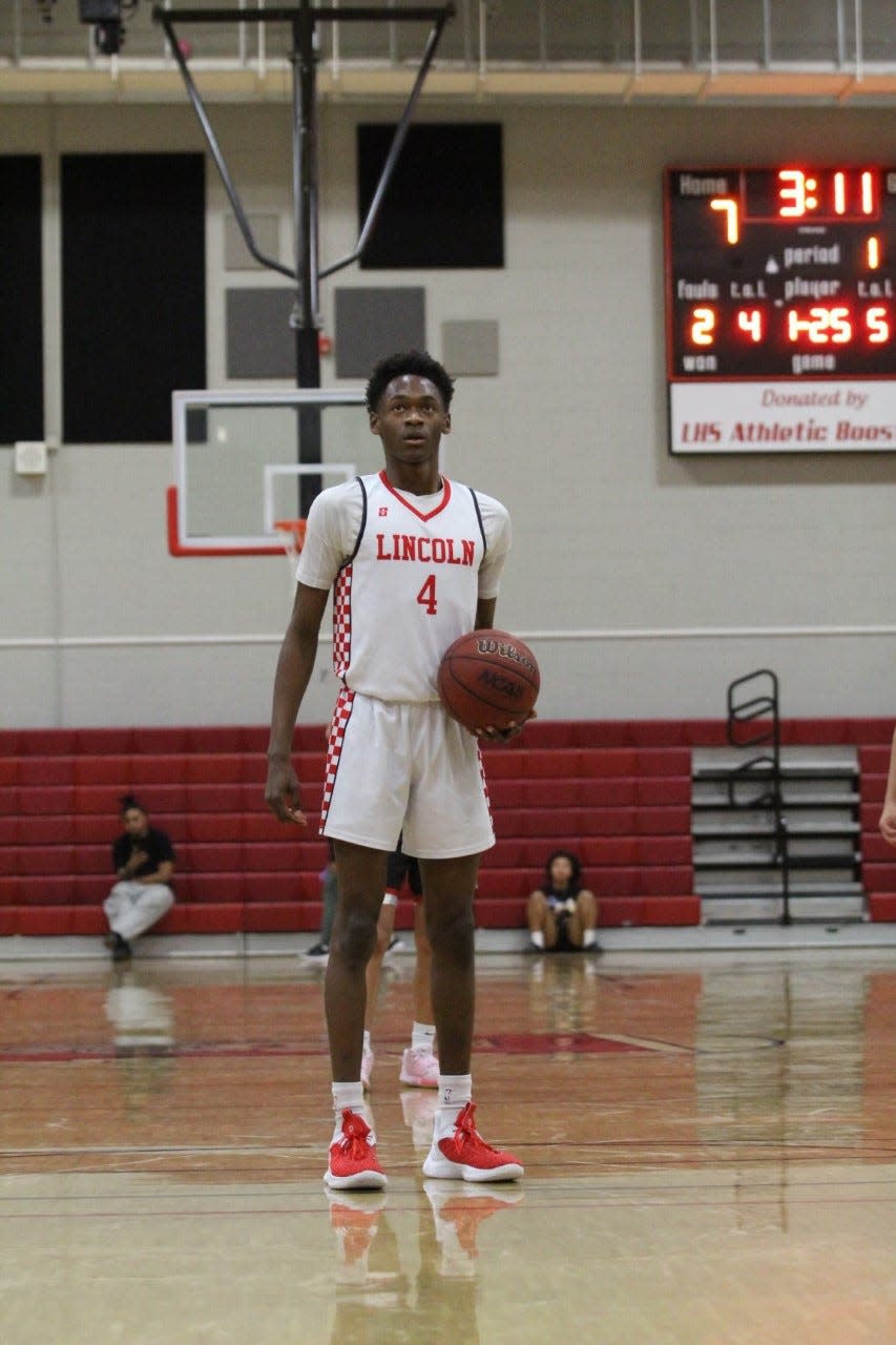 Lincoln sophomore guard Anthony Moore prepares to shoot a free throw during one of the Trojans games in the 2022-23 season.