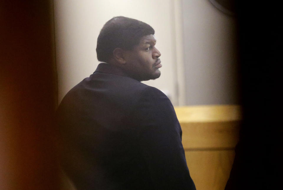 Former Dallas Cowboy Josh Brent stands in court during his trial for intoxication manslaughter, Wednesday, Jan. 15, 2014, in Dallas. Brent is accused of driving drunk at the time of a December 2012 crash that killed Cowboys practice squad player Jerry Brown. (AP Photo/LM Otero)