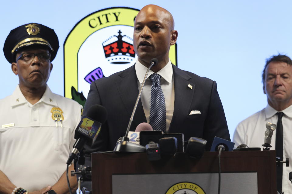 Maryland Gov. Wes Moore speaks at a news conference in Annapolis, Md., on Monday, June 12, 2023, accompanied by Annapolis Police Chief Edward Jackson, left, and Annapolis Mayor Gavin Buckley. Police said a man has been charged with shooting six people, several fatally, in a dispute in his neighborhood in the state's capital city. (AP Photo/Brian Witte)