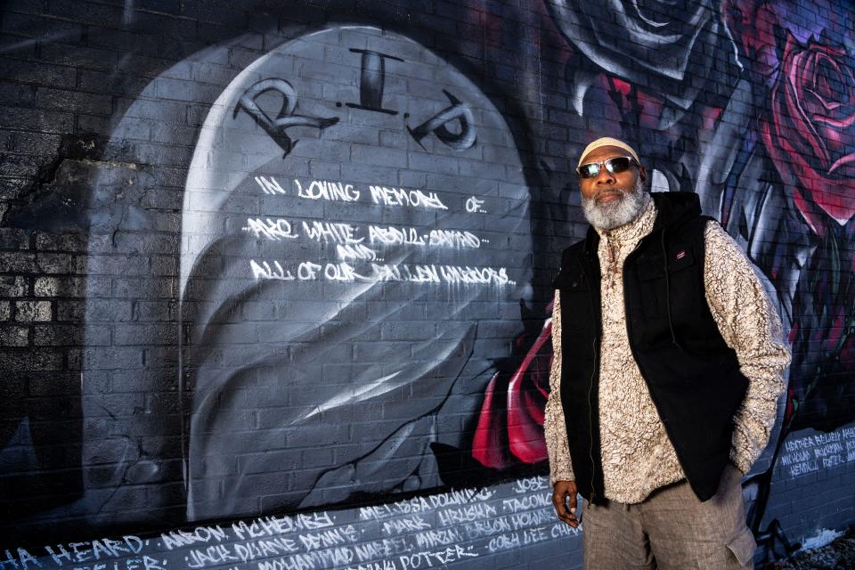 Rep. Ako Abdul-Samad stands for a portrait next to part of a mural dedicated to his son Ako White Abdul-Samad at Creative Visions on Thursday, Nov. 2, 2023, in Des Moines.